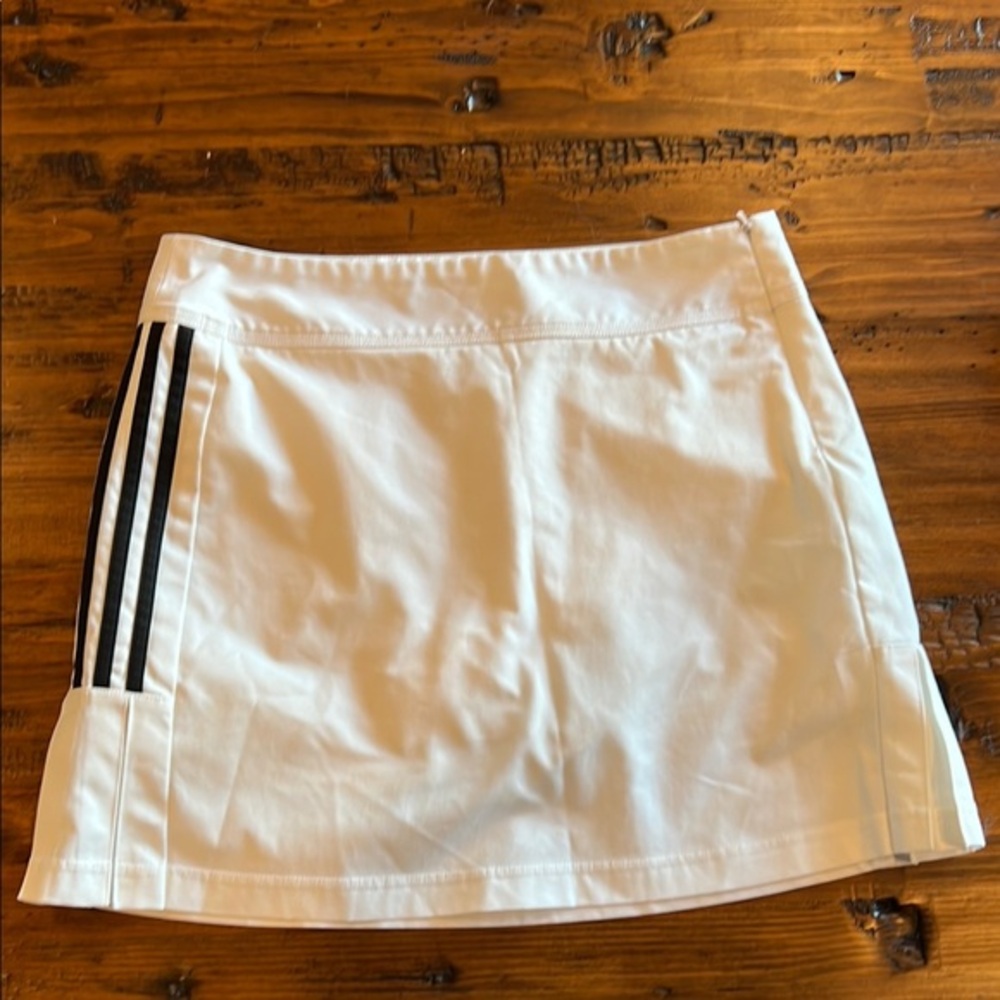 adidas White Athletic tennis skirt with built in‎ shorts.  Side zip climacool